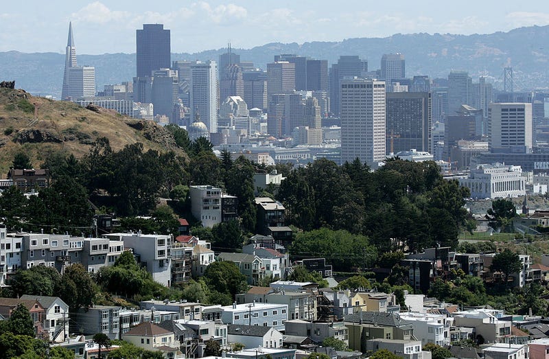 Rows of houses stand in front of the San Francisco skyline June 6, 2007 in San Francisco, California.