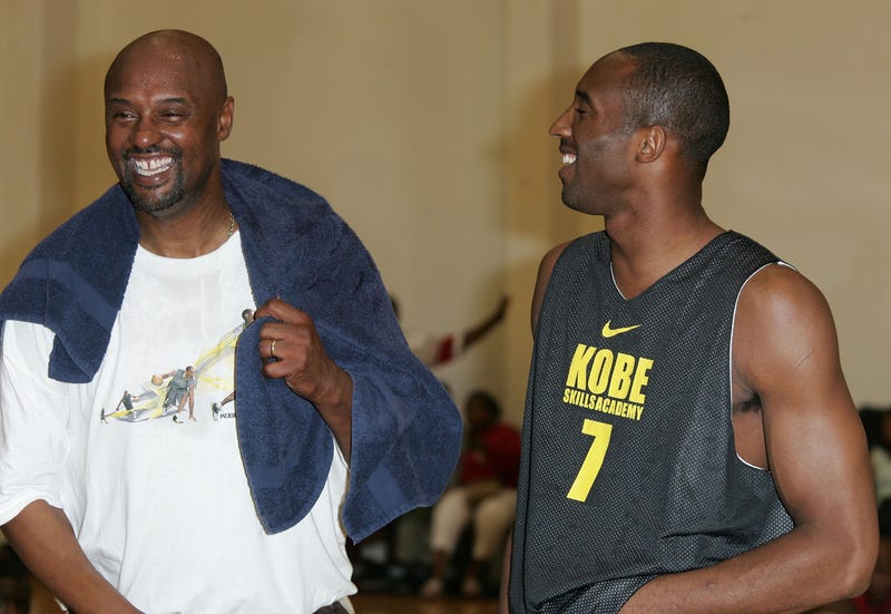 Kobe and Joe Bryant (left) share a laugh at the Kobe Basketball Academy at Loyola Marymount University on July 5, 2007, in Los Angeles, California.
