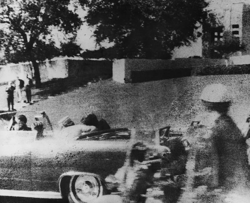 President John F. Kennedy is struck by an assassin's bullet as he travels through Dallas in a motorcade, November 22, 1963. In the car next to him is his wife Jacqueline and in the front seat is Texas Governor John Connally.