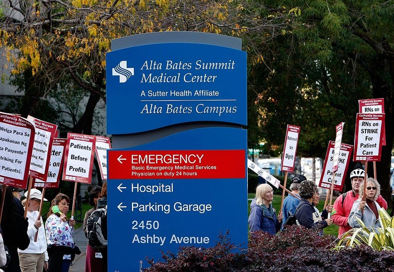 Registered nurses carry signs as they demonstrate outside of Alta Bates Medical Center October 10, 2007 in Berkeley, California.