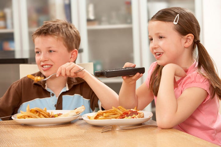 Kids Eating And Watching TV