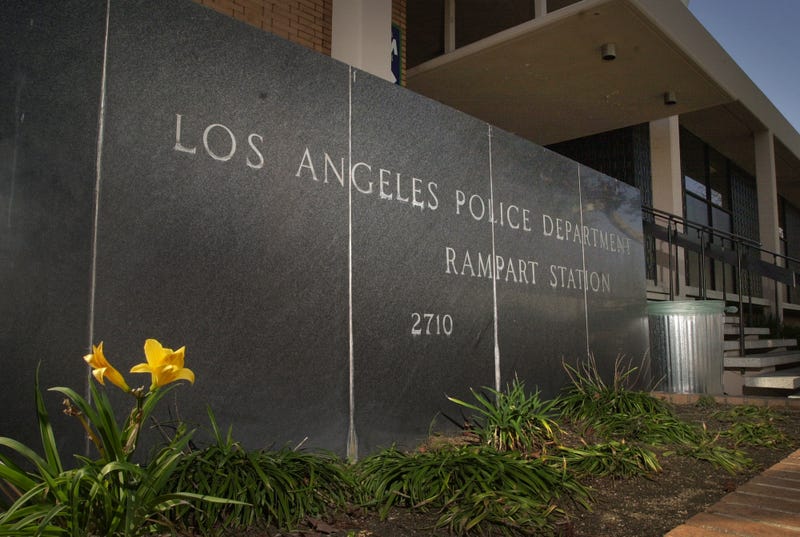 sign in front of building that says los angeles police department rampart station