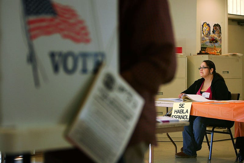 A sign reading, "Se habla Espanol", identifies a bilingual election official as voters go to the polls for Super Tuesday primaries in the predominantly Latino neighborhood of Boyle Heights on February 5, 2008 in Los Angeles, California.