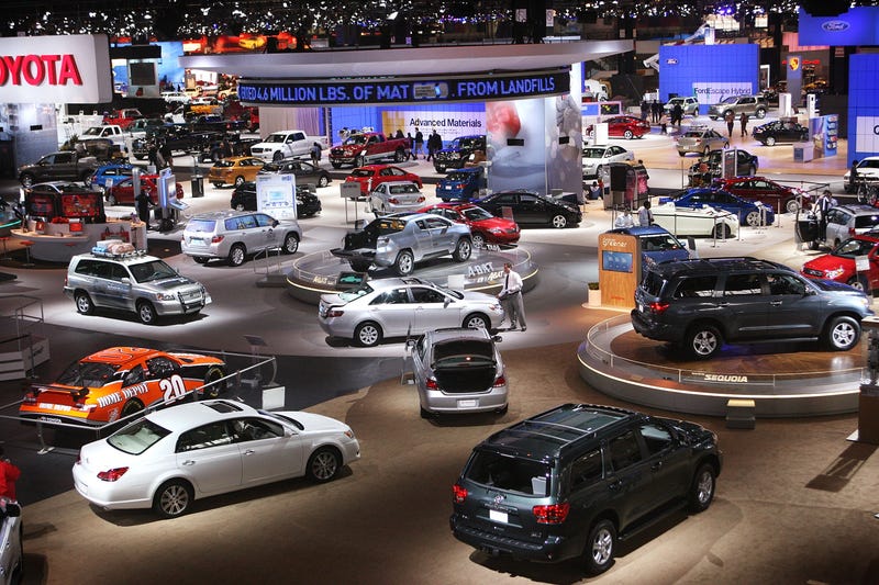 Workers prepare displays for the opening of the Chicago Auto Show February 7, 2008 in Chicago, Illinois.