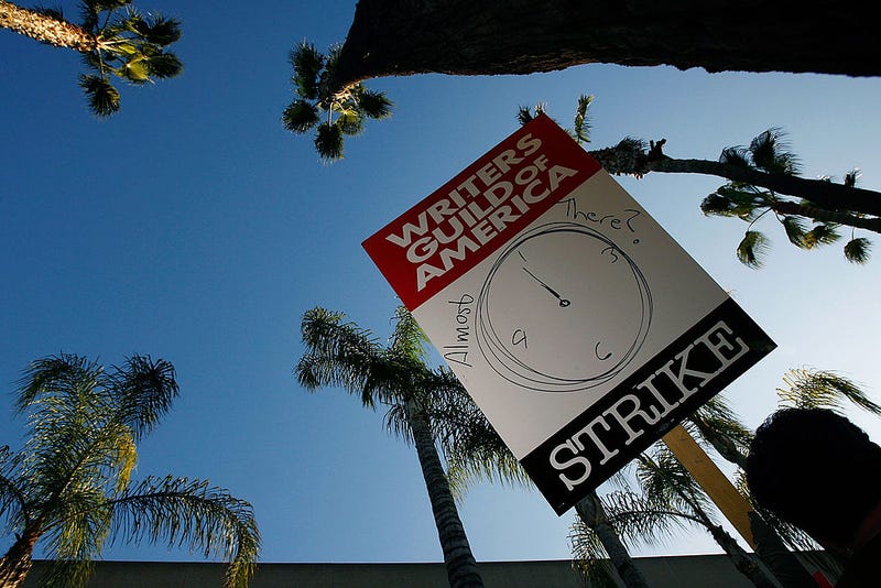 BURBANK, CA - FEBRUARY 08: A picket sign addresses the question of whether the strike may end soon while Writers Guild of America members and supporters picket in front of NBC studios as hope grows that a draft copy of a proposed deal with Hollywood studios being completed today could lead to an end to the three-month old Hollywood writers strike within days, on February 8, 2008 in Burbank, California.
