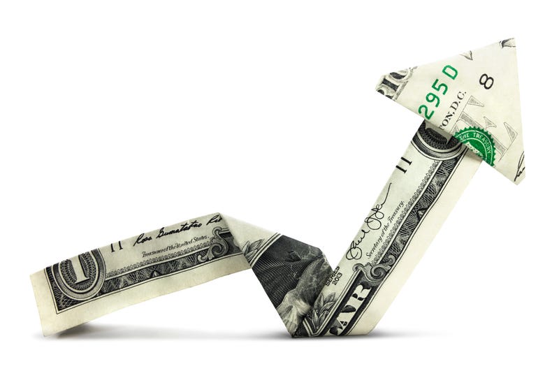 A dollar in the shape of an arrow pointing up.