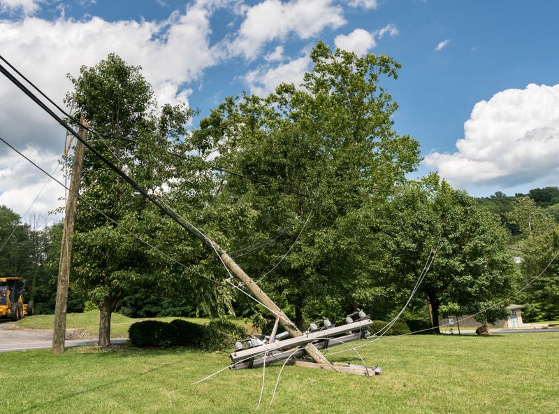 Neighbors are being credited with rescuing a senior citizen after a downed power line ignited a raging house fire on Tuesday afternoon in Macomb County.