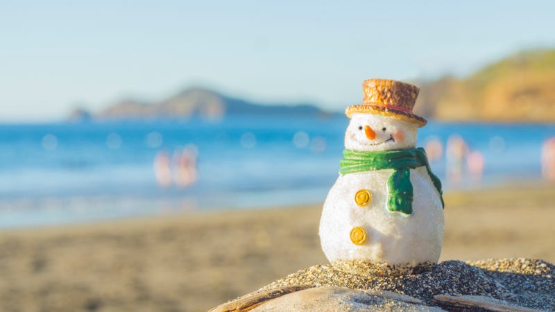 Small snowman on the sand at the beach.