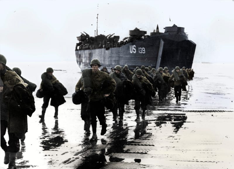 American troops disembark onto the sands of Normandy