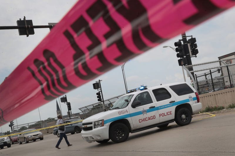 Police investigate the murder of a young man found shot to death in the back seat of a bullet-riddled car on June 30, 2017 in Chicago, Illinois. More than 300 people have been killed and more than 1700 wounded by gunfire in Chicago this year. On June 1, a task force was formed by the Chicago police, Illinois state police and the ATF to combat the gun violence in the city. ATF has formed similar task forces on a temporary basis to fight regional spikes in gun violence. Chicago's task force is the only one in the nation formed with the idea to be permanent.