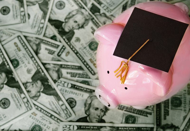 Piggy bank with a graduation cap. 