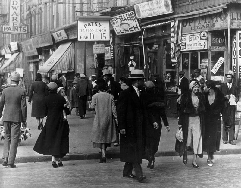A 1942 Harlem street scene in New York City. (Photo by National Archive/Newsmakers)