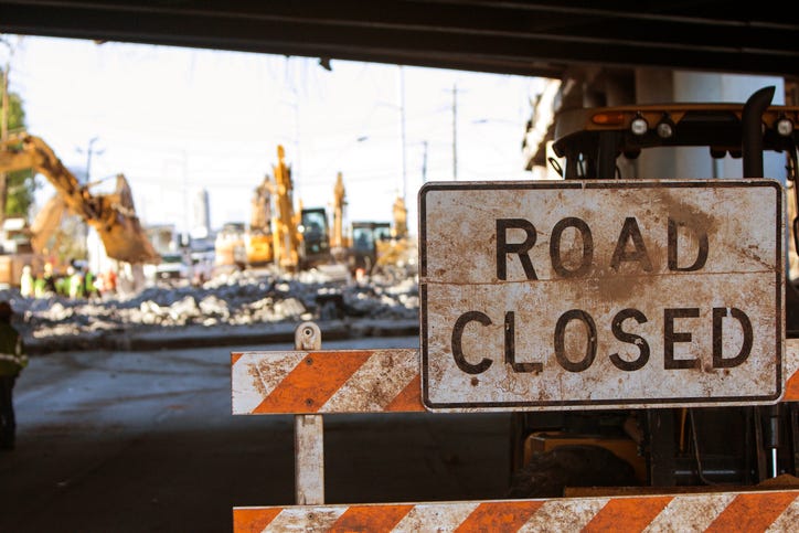 Significant damage to an overpass along US-23 has caused all northbound lanes to close after truck that was hauling a backhoe smashed into the bridge.