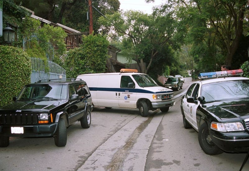 A coroner van arrives at 9701 Yoakum Drive, the scene of a LAPD officer related shooting which resulted in the death of a young costumed Halloween party-goer October 28, 2000 in Bel Air, CA. It is reported that Los Angeles Police Department officers responding to a complaint of a noisy party unable to get an answer at the front door entered the garden of the property and shot dead through a glass door a person who they thought was aiming a gun at the officer. (Photo by Frederick M. Brown/Newsmakers)