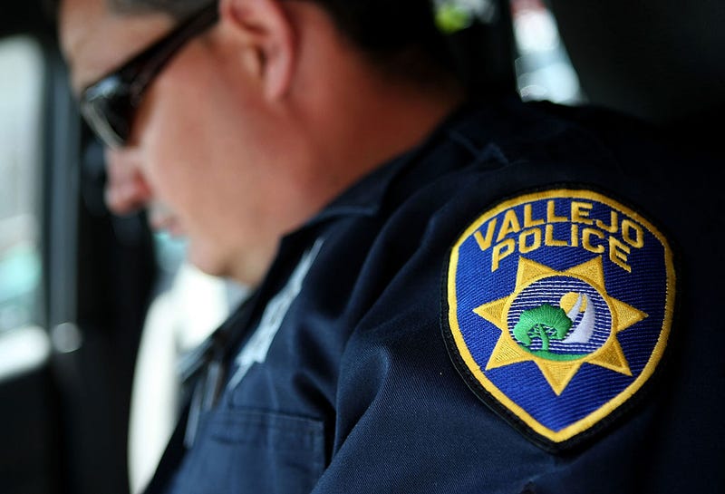 Vallejo Police Department Corporal John Garcia goes over paperwork in his patrol car as he gets ready to patrol the streets May 7, 2008 in Vallejo, California. 