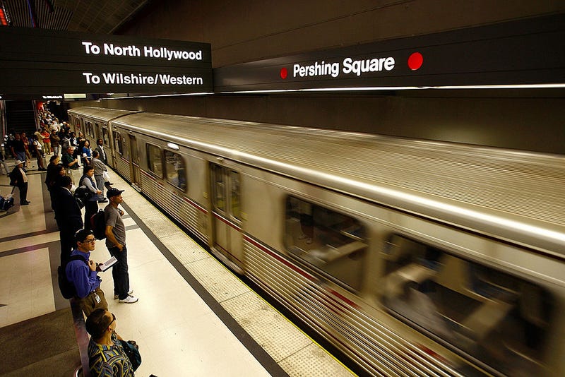 Passengers wait for train.