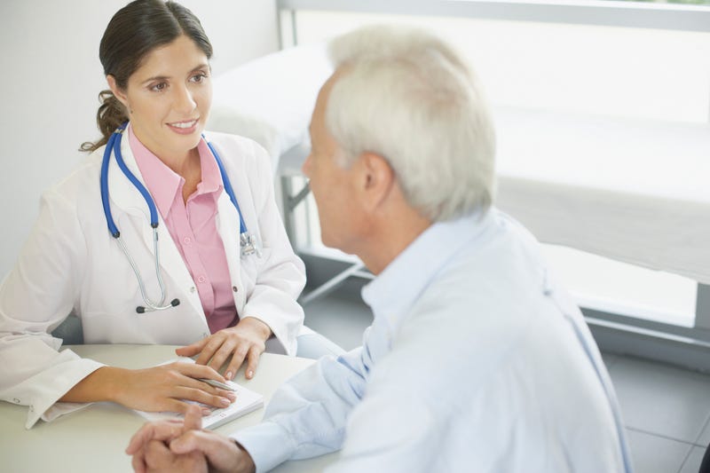 A patient talks with his doctor