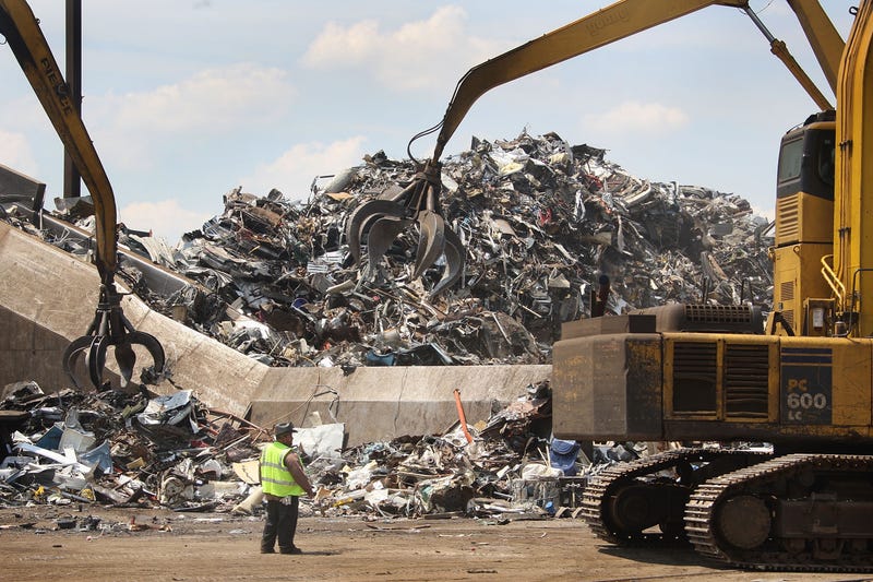 Scrap metal is loaded into a shredder at a metal recycling facility in Chicago.