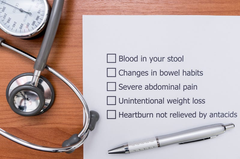 A form that the doctor made to diagnose the disease that indicate Colon Cancer in a patient. Diagnosis form placed on the doctor's desk.