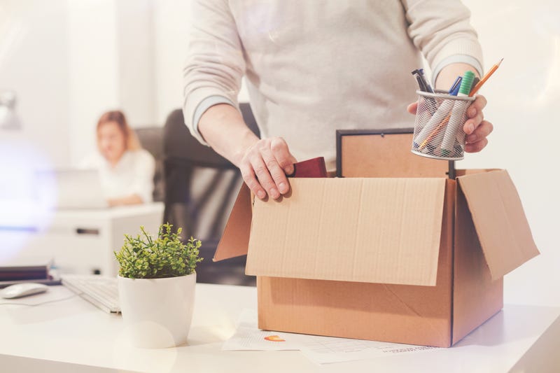 fired worker packing up desk