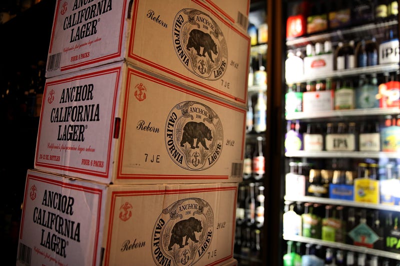 Cases of Anchor Steam California Lager beer are displayed at Coit Liquor on August 3, 2017 in San Francisco, California.