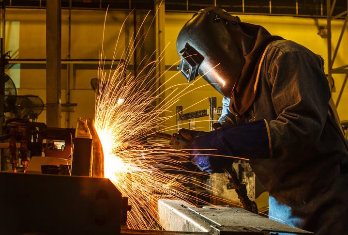 Person learning to weld. 