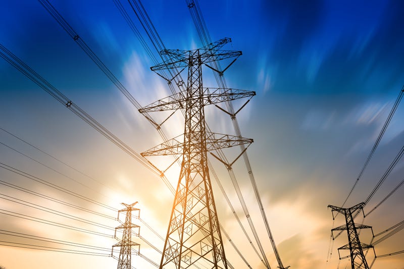 A high voltage tower against a morning sky