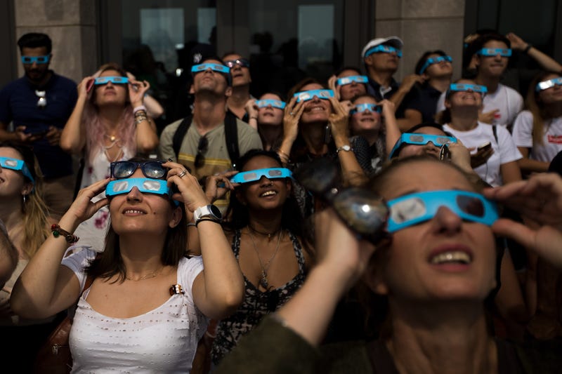 People view the solar eclipse at "Top of the Rock" observatory at Rockefeller Center on Aug. 21, 2017, in New York City.