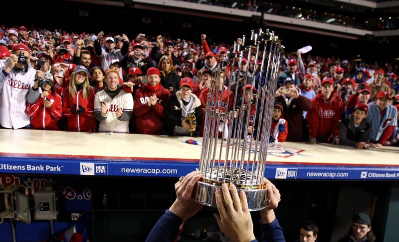 The World Series championship trophy is held up in front of fans of the Philadelphia Phillies after they won 4-3 against the Tampa Bay Rays during the continuation of game five of the 2008 MLB World Series on Oct. 29, 2008, at Citizens Bank Park in Philadelphia, Pennsylvania. 