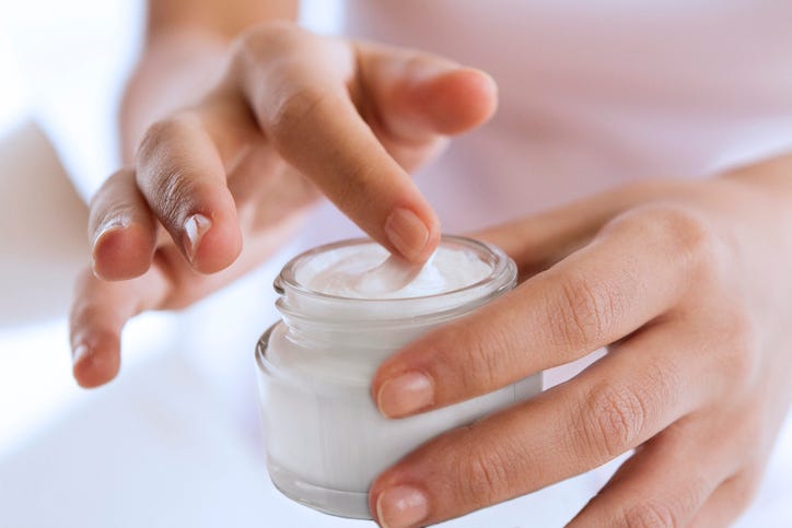 Applying cream on body