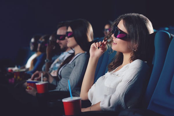 Audience members wearing 3D glasses