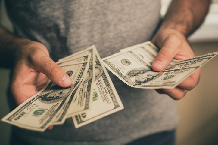 man holding money