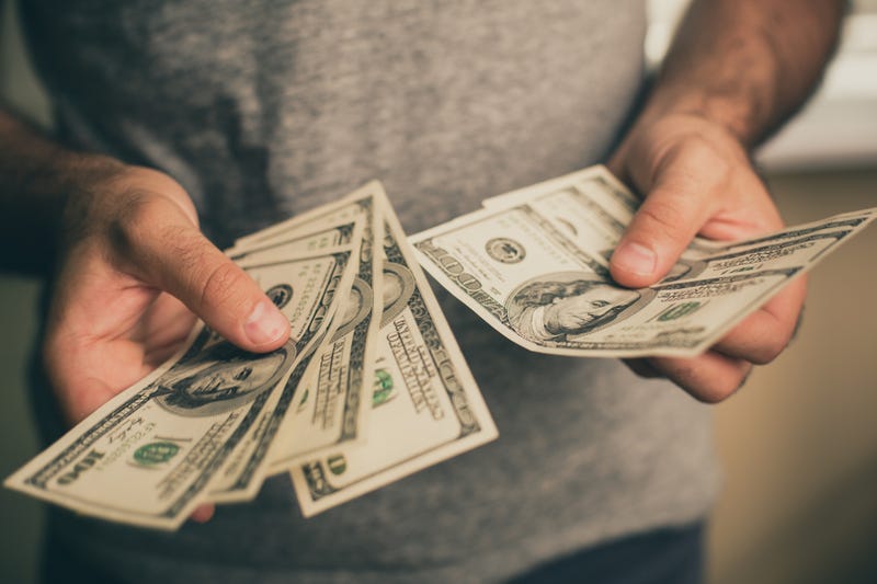 Man holding cash 