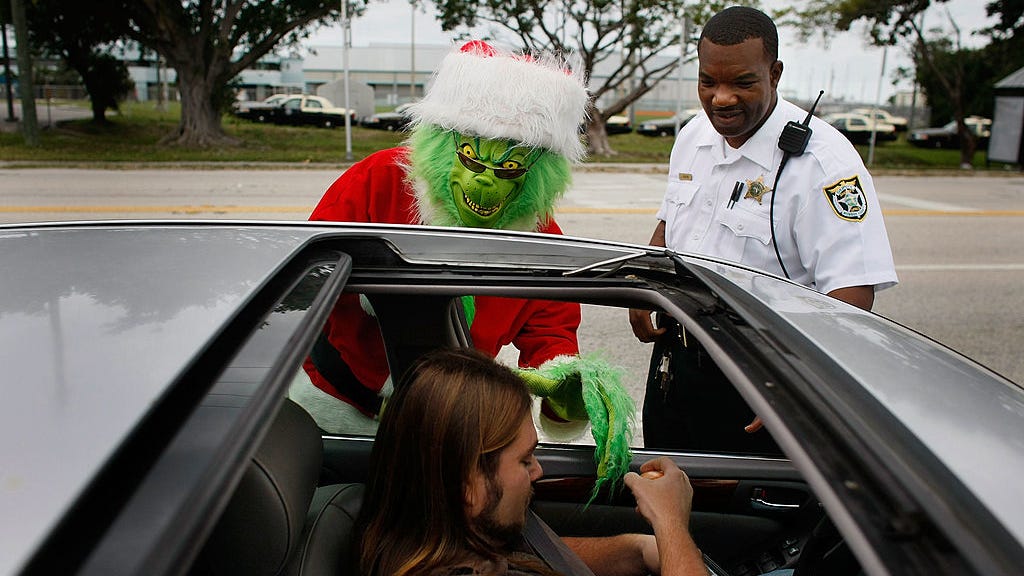 Colonel dressed as Grinch gives onions to speeding motorists