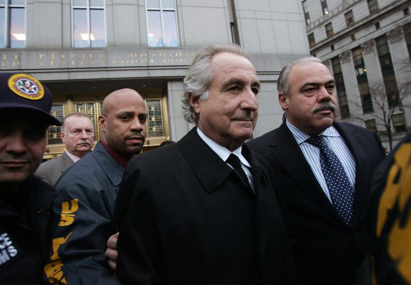 Bernie Madoff (C) walks out from Federal Court after a bail hearing in Manhattan Jan. 5, 2009 in New York City.
