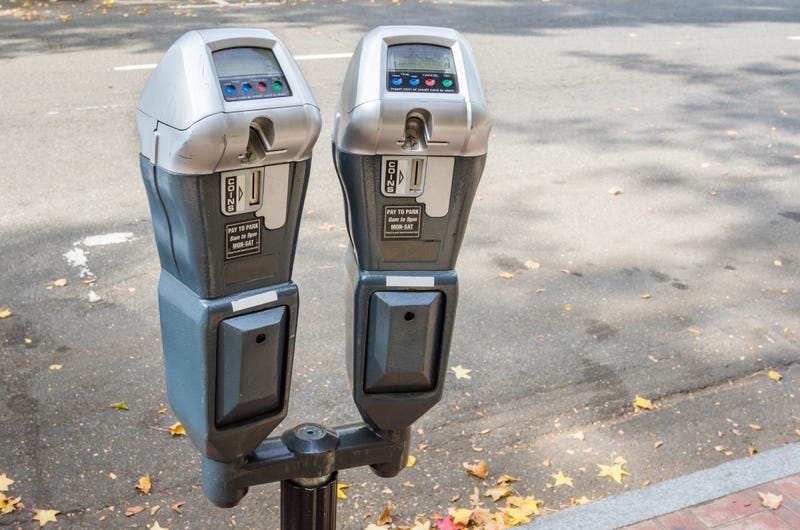 A pair of parking meters on a city street