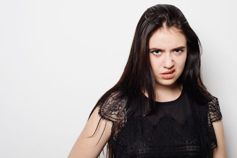 Closeup portrait, pangry, grumpy, skeptical young woman with bad attitude, looking at you