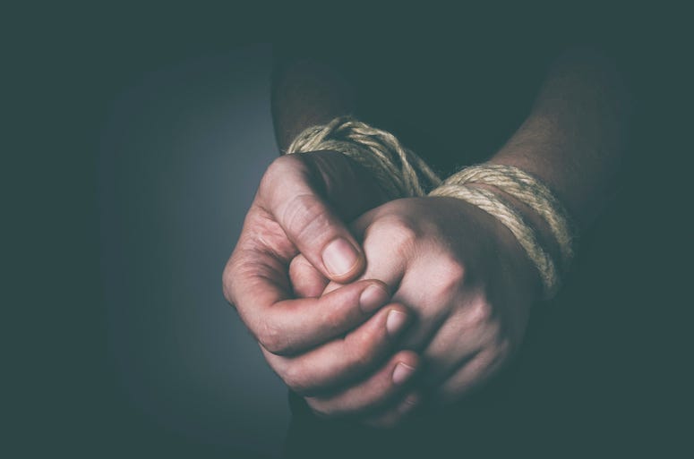 Hands tied with rope