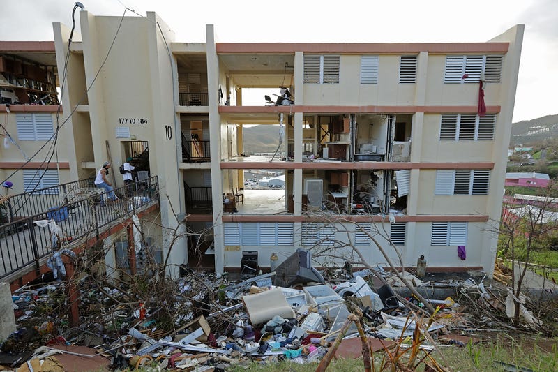 Residents' possessions are shredded and scattered outside the Tutu High Rise more than a week after Hurricane Irma destroyed the building in September 2017. With sustained winds at 150mph, Irma blew completely through the building, killing a woman when she was sucked out of her home.