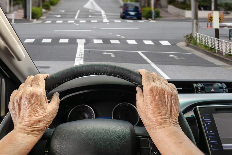 Stock image of senior driving