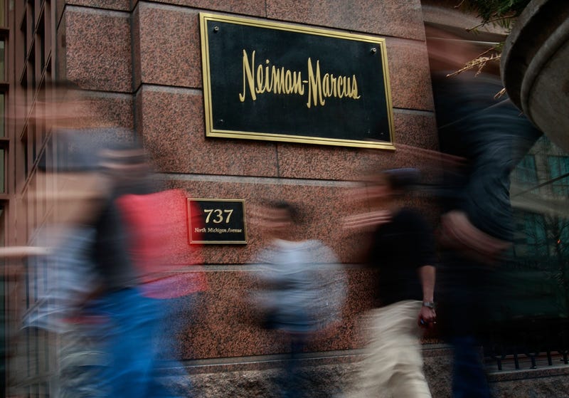 CHICAGO - MARCH 05: Pedestrians walk past a Neiman Marcus store on the Magnificent Mile March 5, 2009 in Chicago, Illinois. Neiman Marcus Group Inc., which operates Neiman Marcus, recently reported a 24 percent decline in sales. (Photo by Scott Olson/Getty Images)