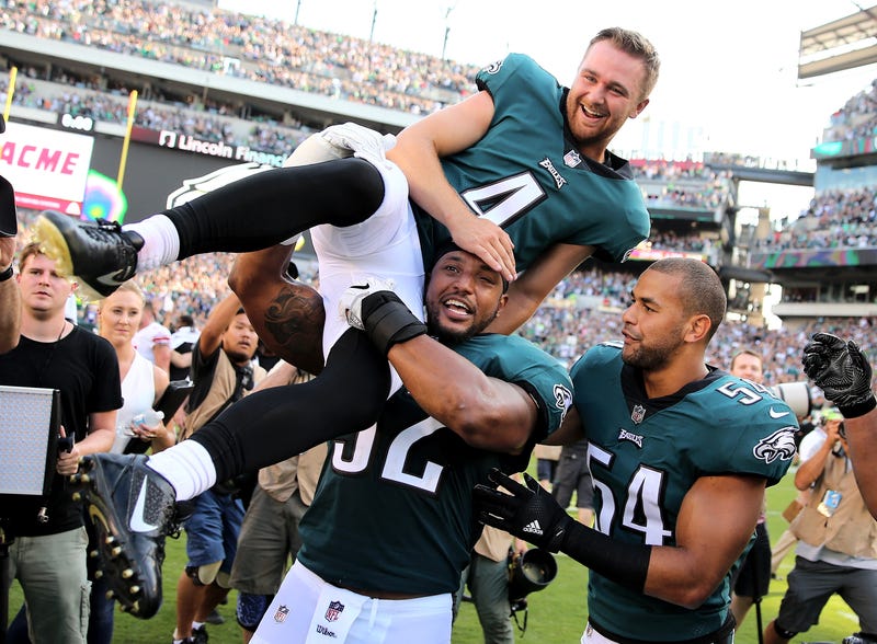 Jake Elliott of the Philadelphia Eagles is picked up by teammates Najee Goode and Kamu Grugier-Hill after Elliott kicked the game-winning field goal with one second left in the game against the New York Giants on Sept. 24, 2017 at Lincoln Financial Field in Philadelphia, Pennsylvania. Elliott kicked the 61-yard field goal to defeat the New York Giants 27-24.
