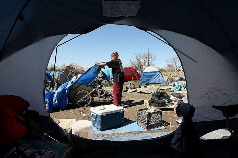Crews are clearing a homeless camp that settled on Apple property in North San Jose.
