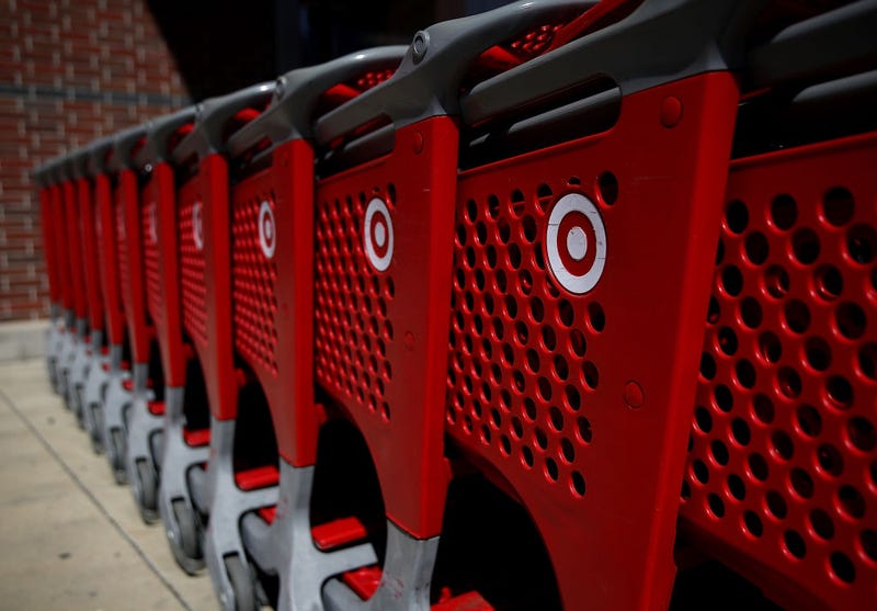 The Target logo is displayed on shopping carts outside of Target store