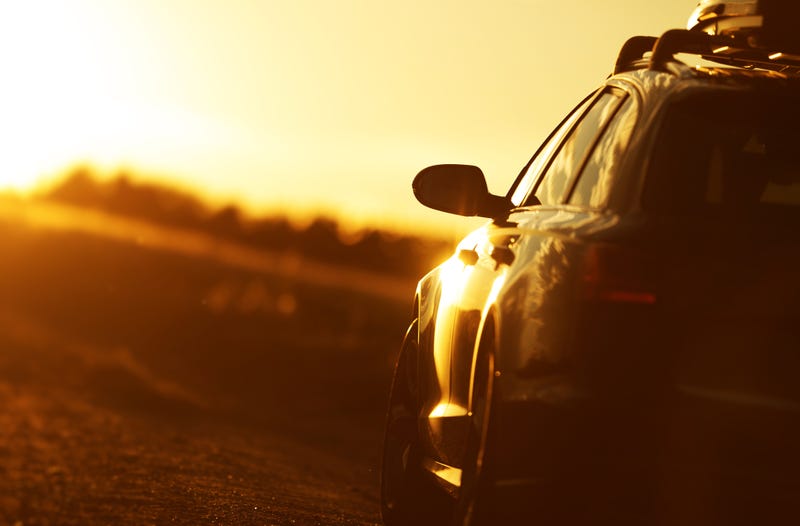 A car sits in the sun.