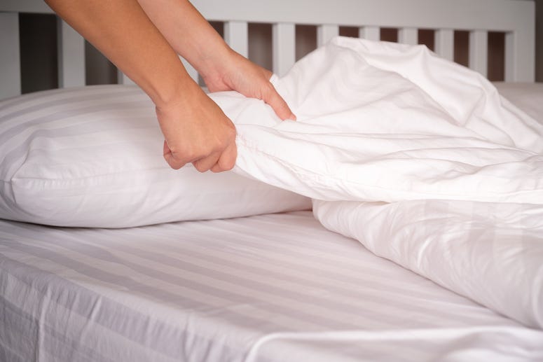 Woman making bed