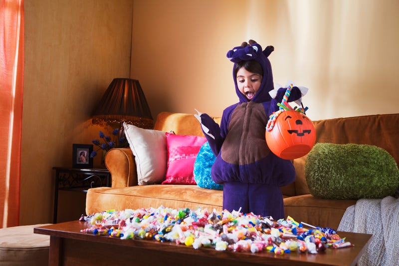 child with halloween candy