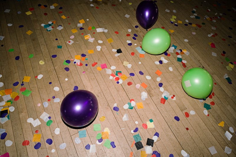 balloons and confetti on gym floor