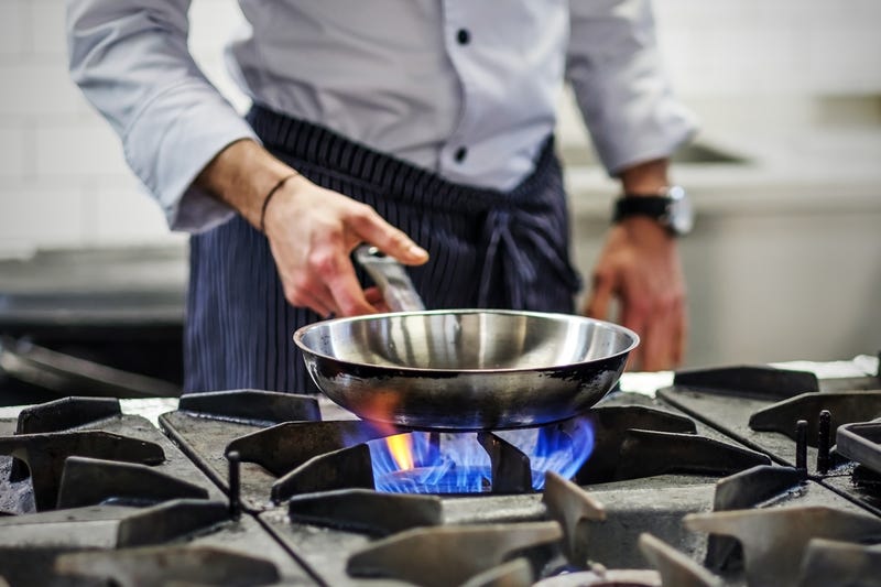 Man cooking on a gas stove