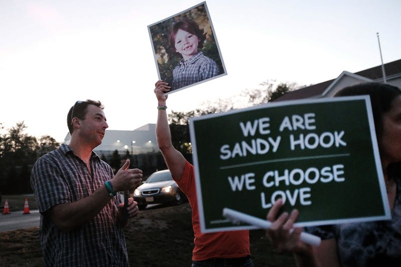 A vigil in Newtown, 10/4/17, in memory of 58 people killed with assault weapons in a shooting in Las Vegas.